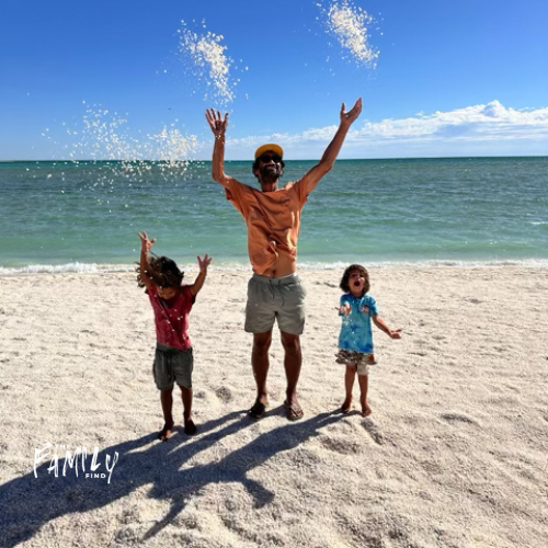 shows father and 2 kids throwing shells into the air.